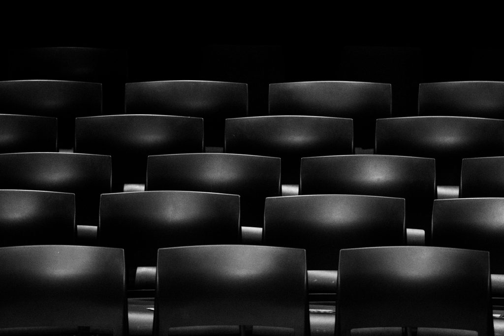 Rows of dark theater seats